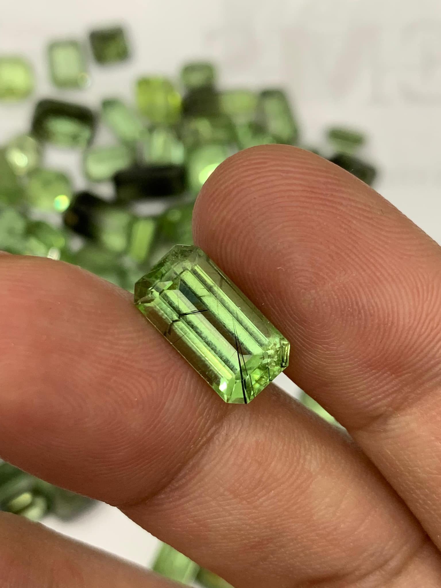 Checkout these apple green rare peridots with Ludwigite Inclusions