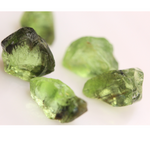 Raw Peridots with rare inclusions of Ludwigite