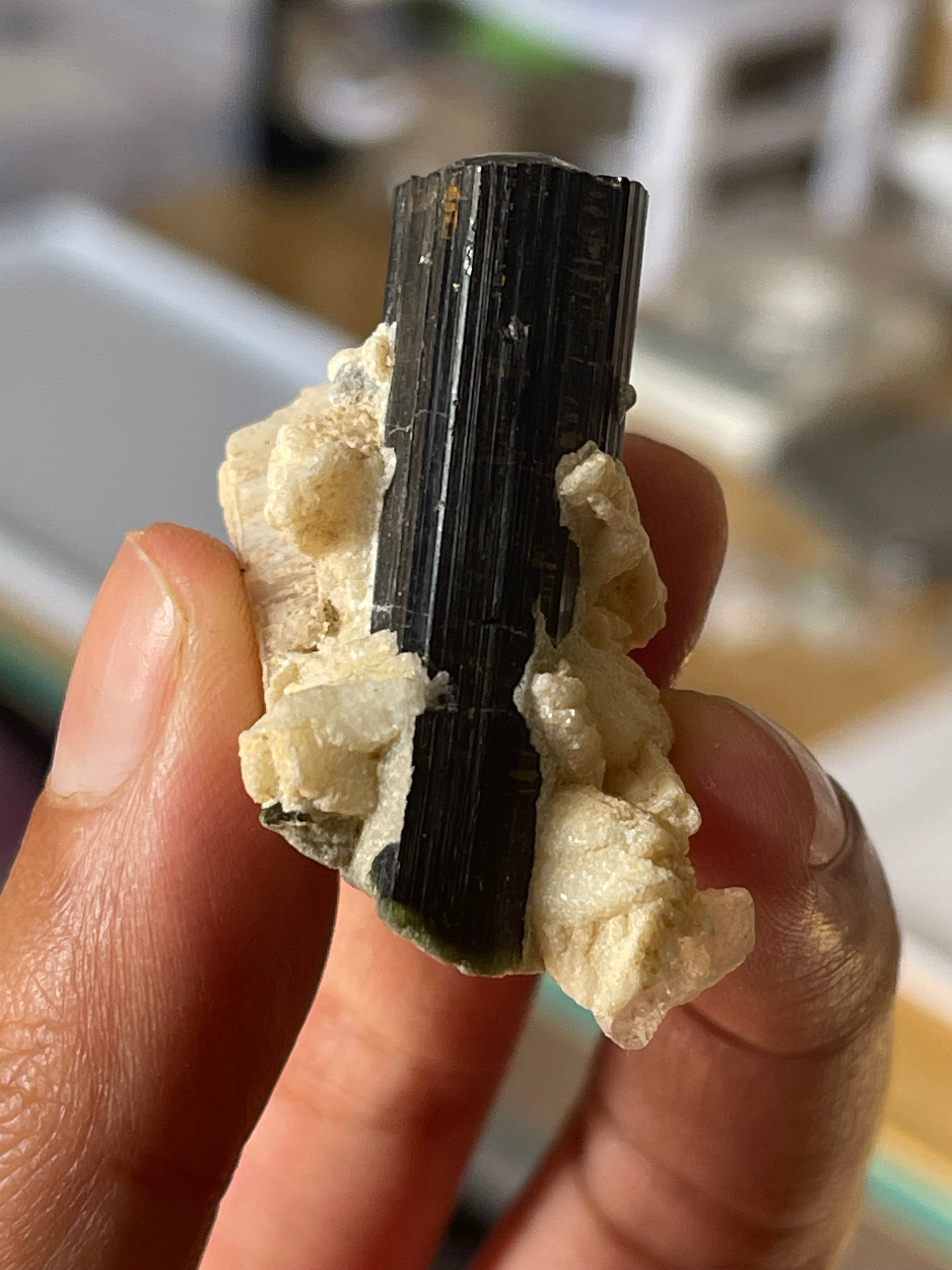 Black tourmaline crystals on feldespar