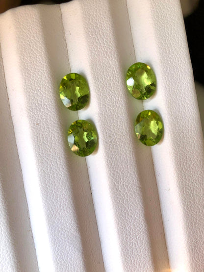 7.6 carats 9 x 7mm Oval Cut Green Peridot Pairs - 4 Pieces