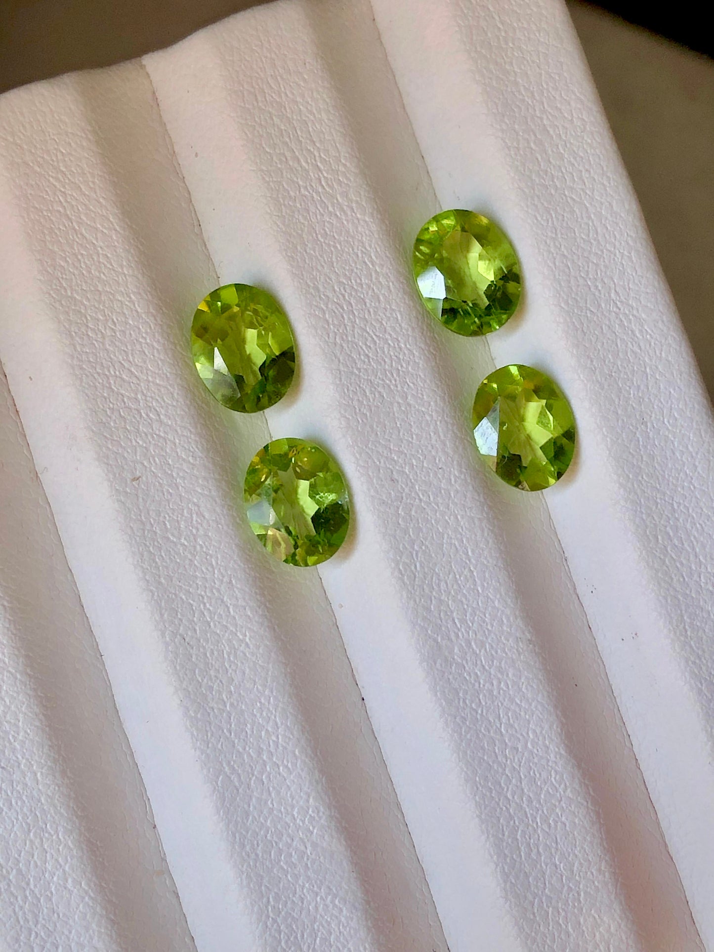 7.6 carats 9 x 7mm Oval Cut Green Peridot Pairs - 4 Pieces