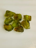 Facet the raw peridots and design peridot jewelry